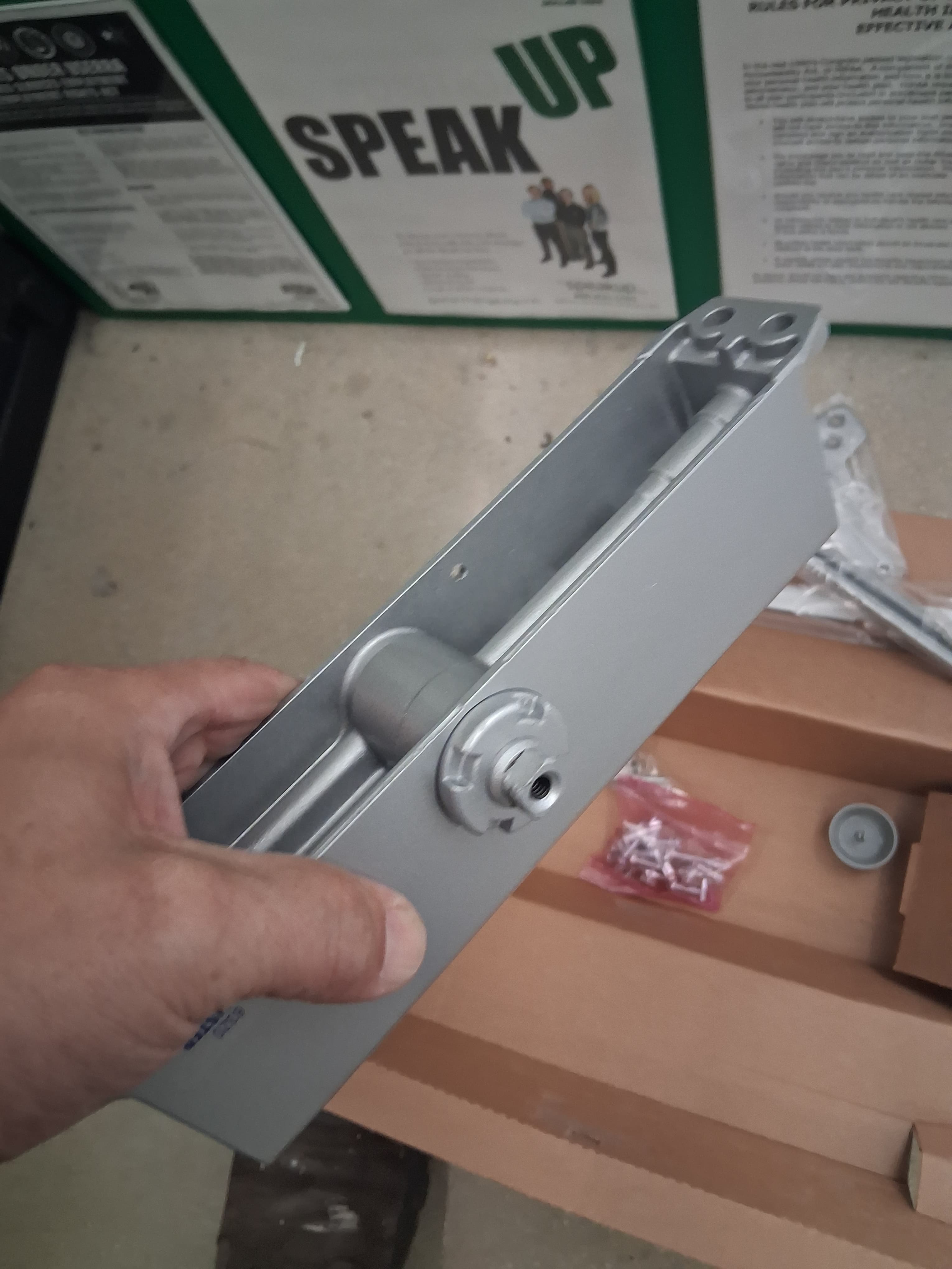 Commercial door closer before replacement
