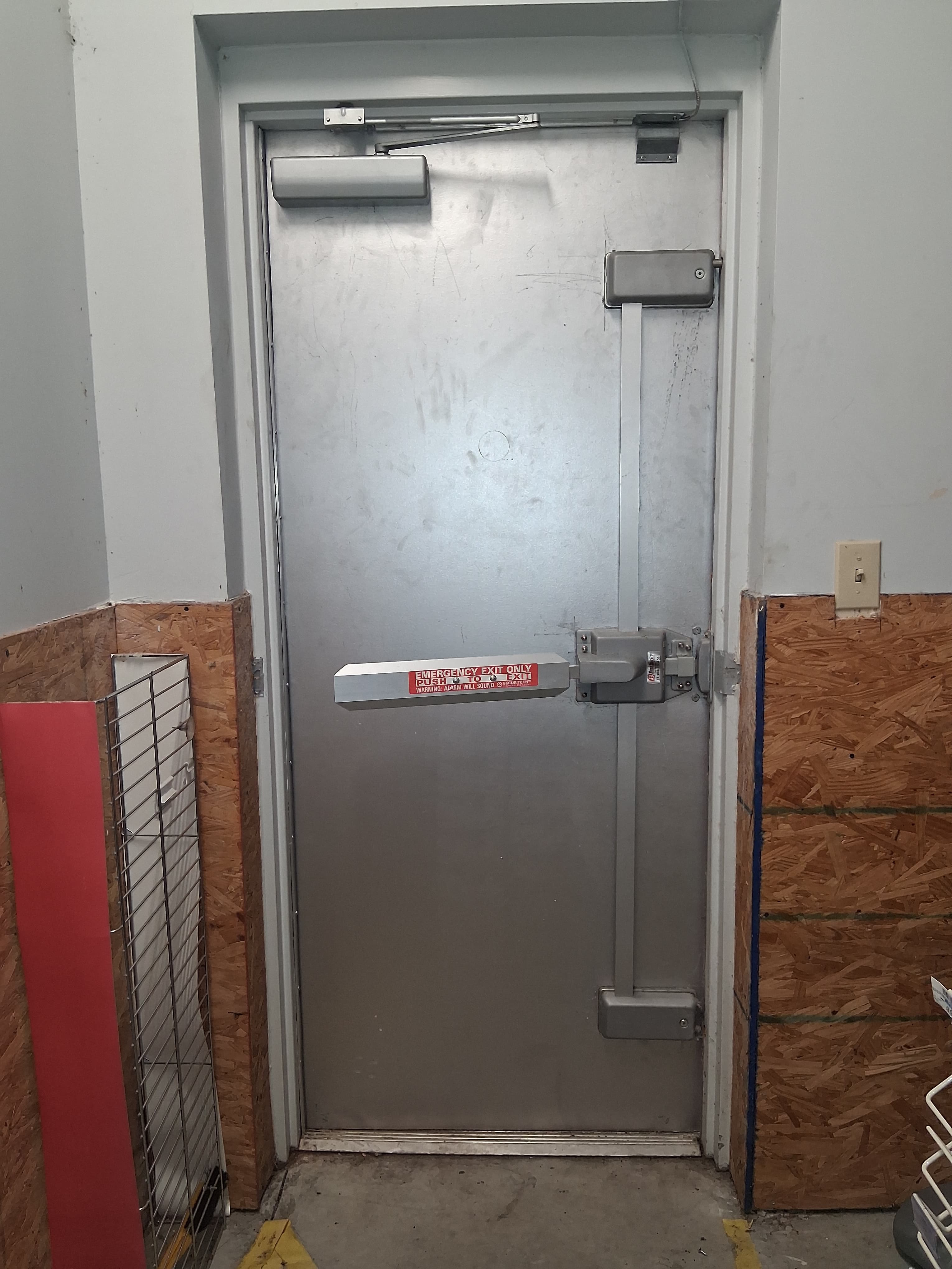 Completed commercial exterior door with exit hardware