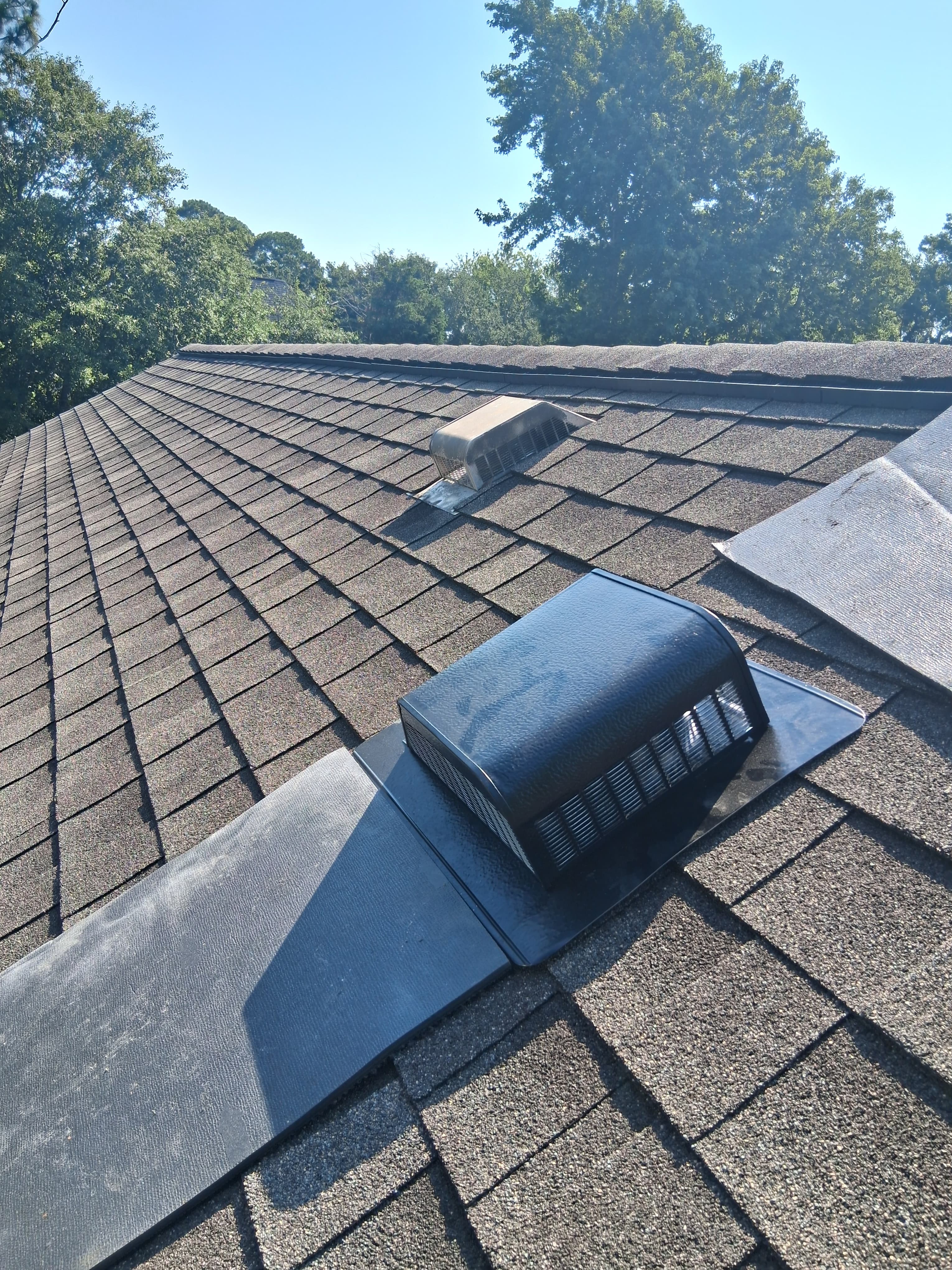 Residential roof vent repair in progress
